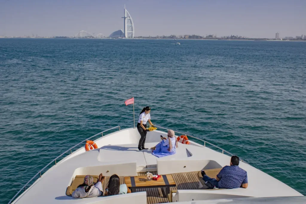 Crew catering food to clients on a luxury yacht