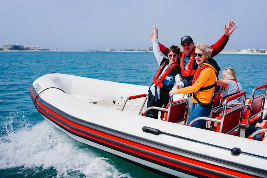 Family taking a photo on a speed boat